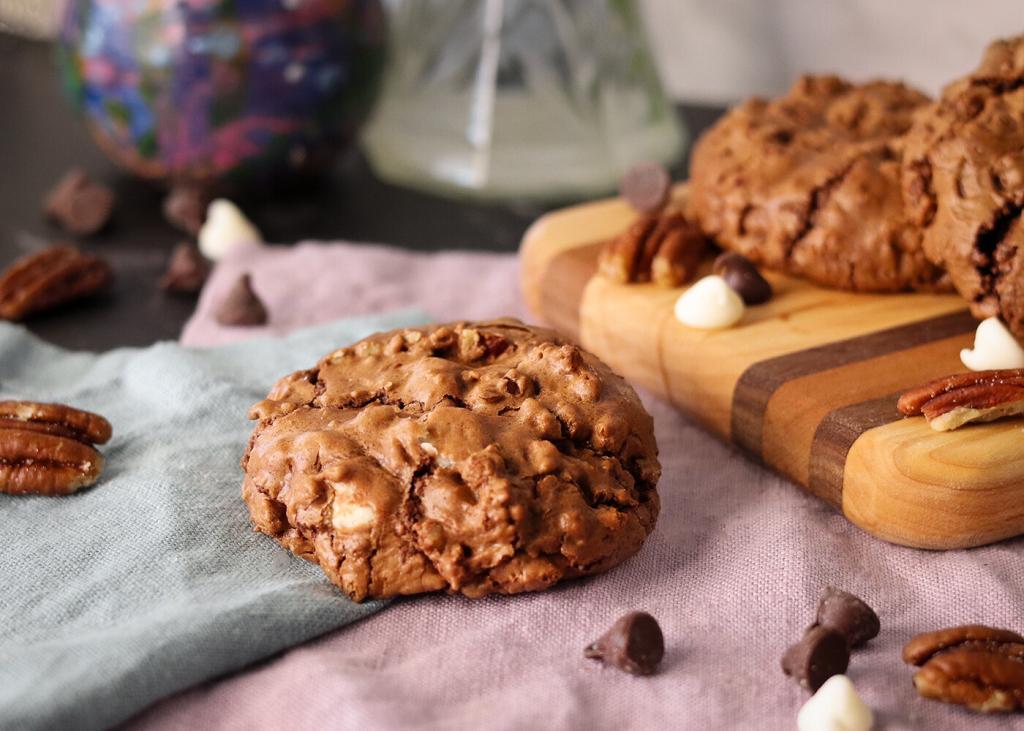 Chocolate Bliss Cookie on napkins in front of a serving board with more cookies.